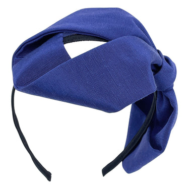 A blue grosgrain headband featuring an oversized bow.