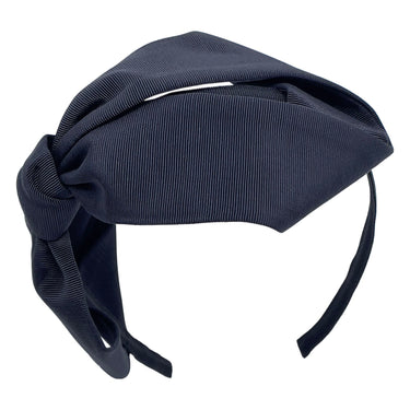 A black grosgrain headband featuring an oversized bow